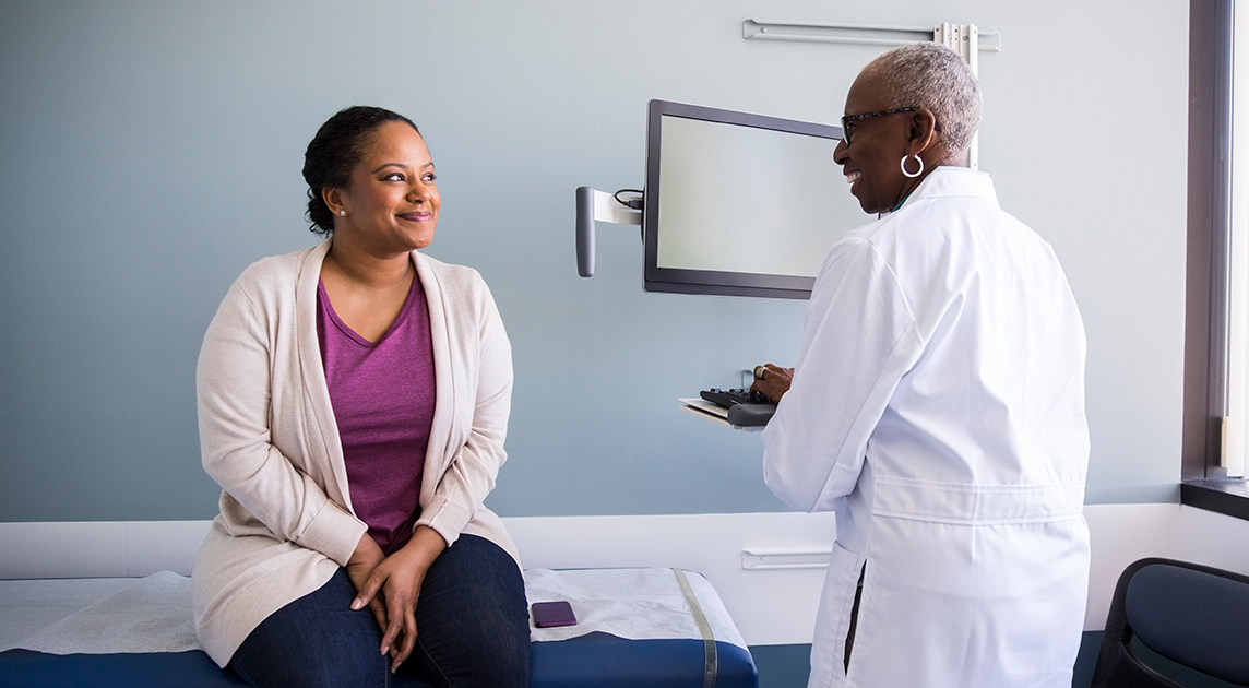 A woman talking to her doctor